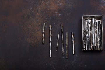 set of drill bits for drills on a vintage background