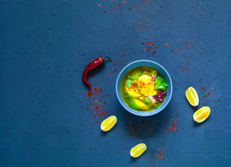 Mexican Lime Soup in Blue Bowl. The concept of tasty and healthy meal. 