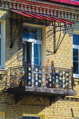 Old CDs - Strange Decoration of the Balcony Fence. Provincial City Architecture