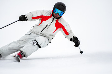 Skier on slope in mountains