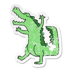 Fototapeta premium distressed sticker of a quirky hand drawn cartoon crocodile