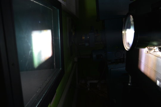 DCP movie projector screening in a cinema, projection booth, close-up
