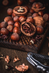 Walnuts and hazelnuts on cutting board