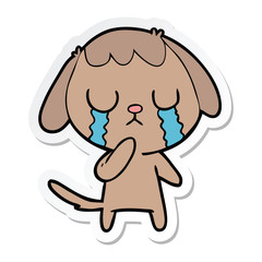 sticker of a cute cartoon dog crying