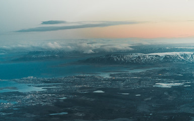 Aerial view of sunrise in winter nature landscape in north Iceland with glaciers in background. Snow Capped mountains and Glacier.