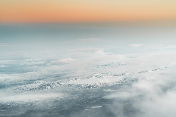 Aerial view of sunrise in winter nature landscape in north Iceland with glaciers in background. Snow Capped mountains and Glacier.