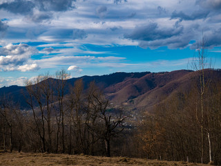 Beautiful landscape in the mountains at sunset. View of colorful sky with amazing clouds.