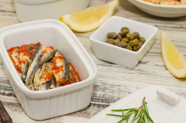 Anchovy fillets marinated in tomato sauce.   Fish tapas – antipasto. 