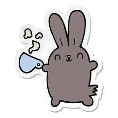 sticker of a cute cartoon rabbit with coffee cup