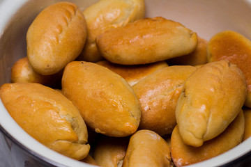Fresh pies with meat, cabbage or any filling. Baked pies in the oven.