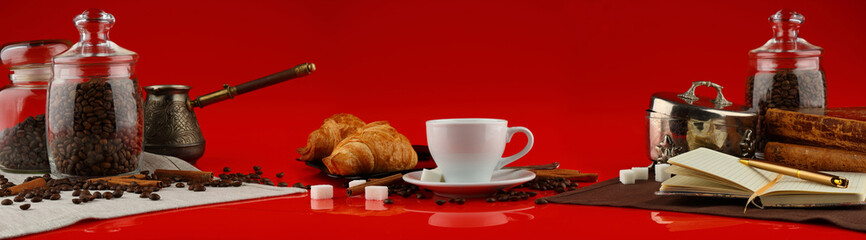 Coffee panorama with white mug and coffee accessories on red background