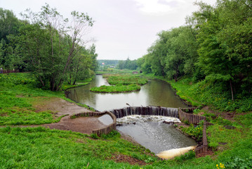 Chermyanka river in a park in Moscow, cloudy weather.