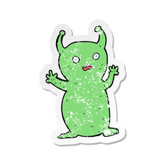 retro distressed sticker of a cartoon funny little alien