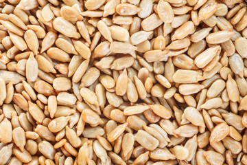 Peeled Sunflower Seeds Texture As Background. Top view.