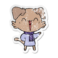 distressed sticker of a happy little cartoon dog in winter clothes
