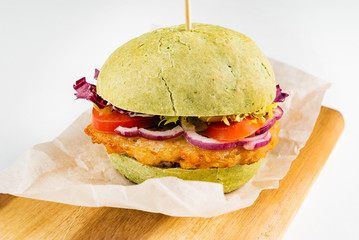 green vegan burger with vegetables and veggie cutlet