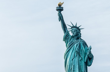 Fototapeta na wymiar Statue of Liberty against blue sky in New York City