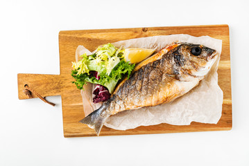 baked fish dorado with salad