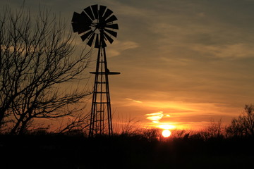 Kansas Windmill Silhouette with clouds and tree