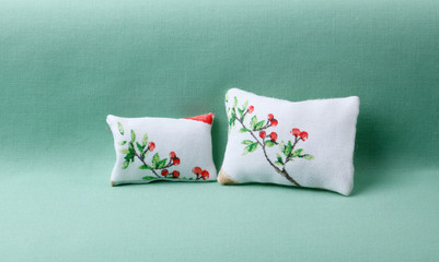 Nature style cushions on green sofa