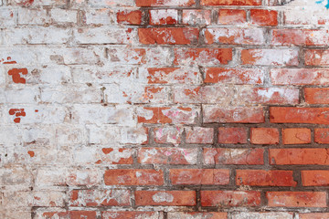 Old brick wall with scratches, cracks, dust, crevices, roughness. Can be used as a poster or background for design.