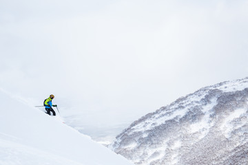 Naklejka na ściany i meble Telemark skier in the backcountry of Niseko Japan.