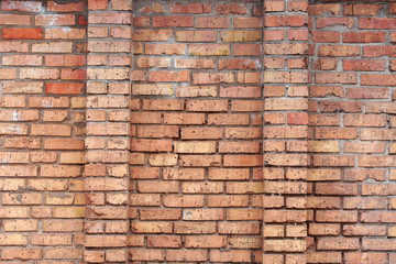 Old brick wall with scratches, cracks, dust, crevices, roughness. Can be used as a poster or background for design.