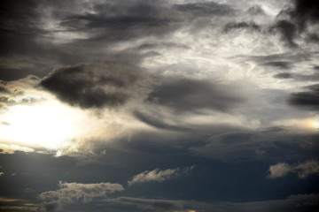 Hole of the Sky in the Dark Storm Clouds. Symbol of the struggle of good and evil. Light in the Dark and Dramatic Storm Clouds.