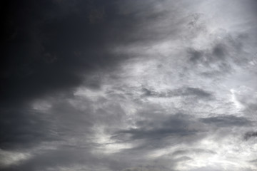 Hole of the Sky in the Dark Storm Clouds. Symbol of the struggle of good and evil. Light in the Dark and Dramatic Storm Clouds.