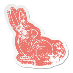 cute cartoon distressed sticker of a rabbit wearing santa hat