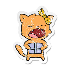distressed sticker of a cartoon cat with christmas present
