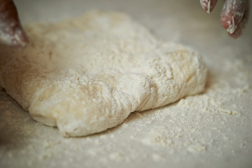 Stretching pizza dough 
