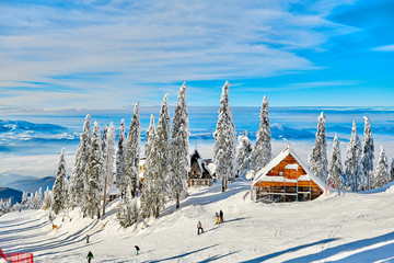 Wooden chalets and spectacular ski slopes in the Carpathians,Poiana Brasov ski...