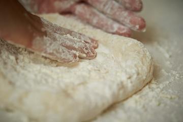 Stretching pizza dough 