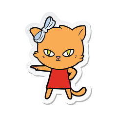 Obraz na płótnie Canvas sticker of a cute cartoon cat wearing dress