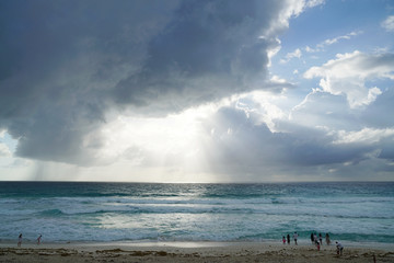 Fototapeta na wymiar sunlight from behind storm cloud on top of Caribbean sea
