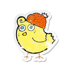 retro distressed sticker of a cartoon bird wearing hat