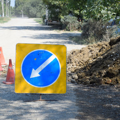 Sign of detour travel. Pit on the road. repair work.