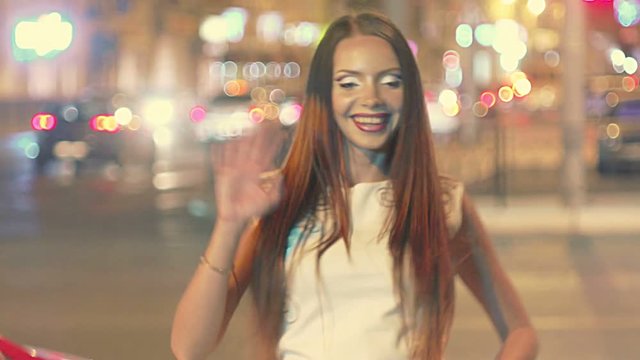 Young girl fummy grimacing in the night city