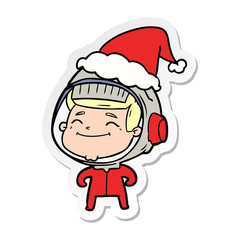 happy sticker cartoon of a astronaut wearing santa hat