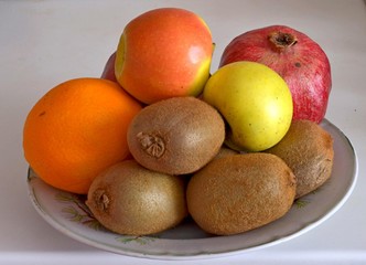 Fruits on isolated background Kiwi Apple pomegranate Orange