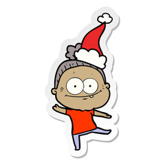 sticker cartoon of a happy old woman wearing santa hat