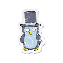 retro distressed sticker of a cartoon penguin wearing hat