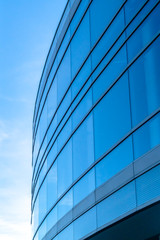 Fototapeta na wymiar Relective blue glass windows of a building