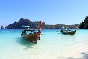 Naklejka na ściany i meble Long tail boat and tropical beach on Phi Phi island Thailand