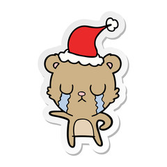 crying sticker cartoon of a bear wearing santa hat