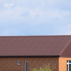 Fototapeta premium The roof of corrugated sheet on the houses