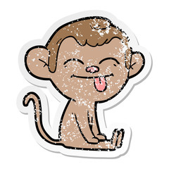 distressed sticker of a funny cartoon monkey sitting