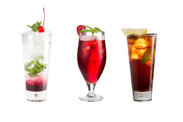 A variety of alcoholic drinks, beverages and cocktails on a white background. Three refreshing different drinks with berries decoration.