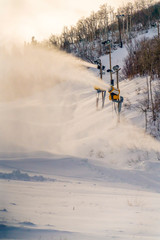 Snow cannons preparing ski slope in Park City Utah